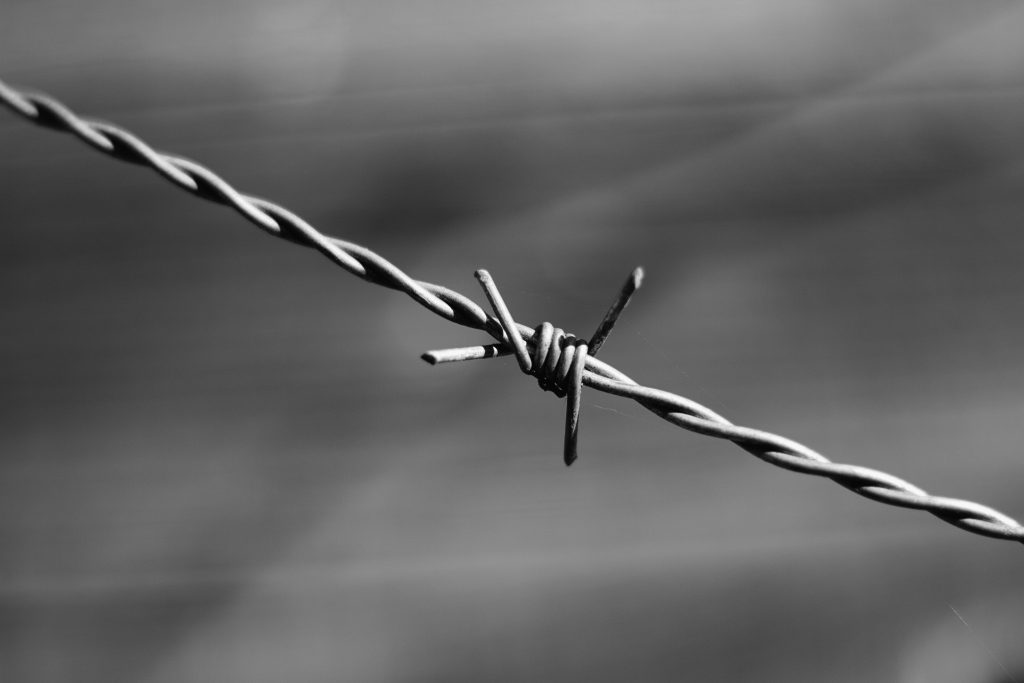 how to install a barbed wire fence